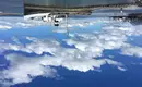 Verankerte Schiffe an Patagoniens Küste Zwei verankerte Schiffe unter blauem Himmel in einer ruhigen Hafenlandschaft.